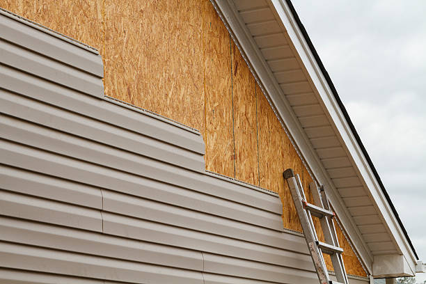 Professional Siding technician working in Warriors Mark, PA